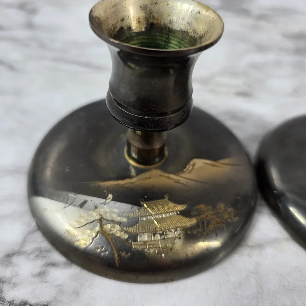 Vtg Pair Japanese brass bud vases featuring an etched pagoda and mountain scene